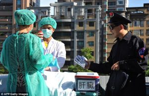 People are shown mocking up an operation as part of a 2014 protest